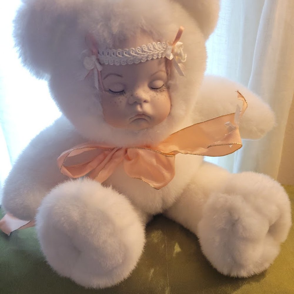 Cute, realistic baby doll in bear suit